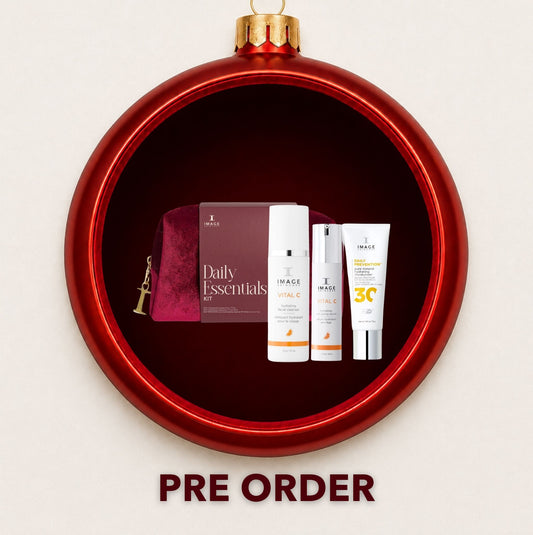 IMAGE Skincare Daily Essentials SPF 30 gift set displayed inside a red Christmas bauble