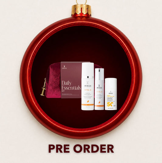 IMAGE Skincare Daily Essentials SPF 50 gift set displayed inside a red Christmas bauble
