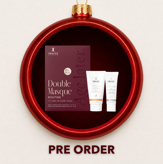 IMAGE Skincare Double Mask Routine gift set displayed inside a red Christmas bauble