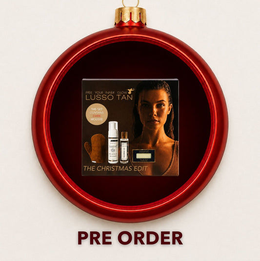 Lusso Tan Christmas Edit gift set displayed inside a red Christmas bauble