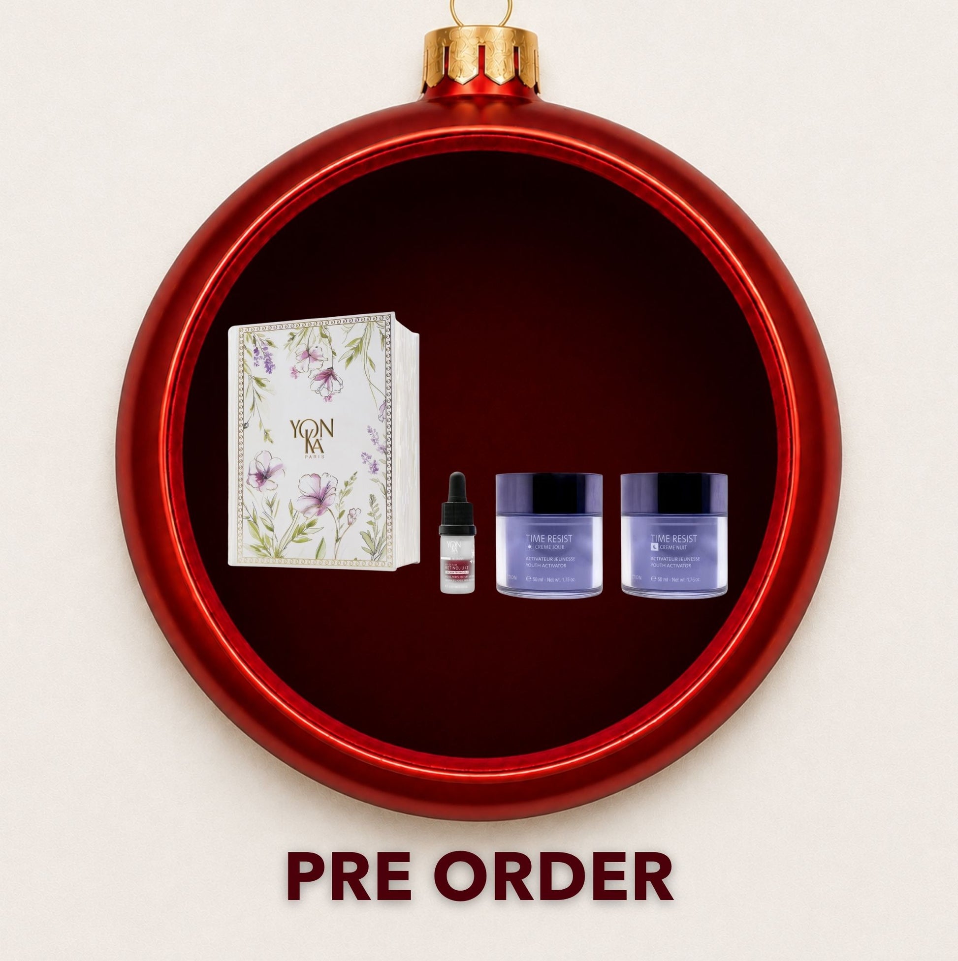 Yon-Ka Day and Night Anti-Ageing gift set displayed inside a red Christmas bauble